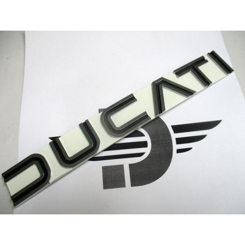 Anagrama lateral deposito NUEVO Original Ducati 250-350-500 (228x30mm Fondo Blanco)
